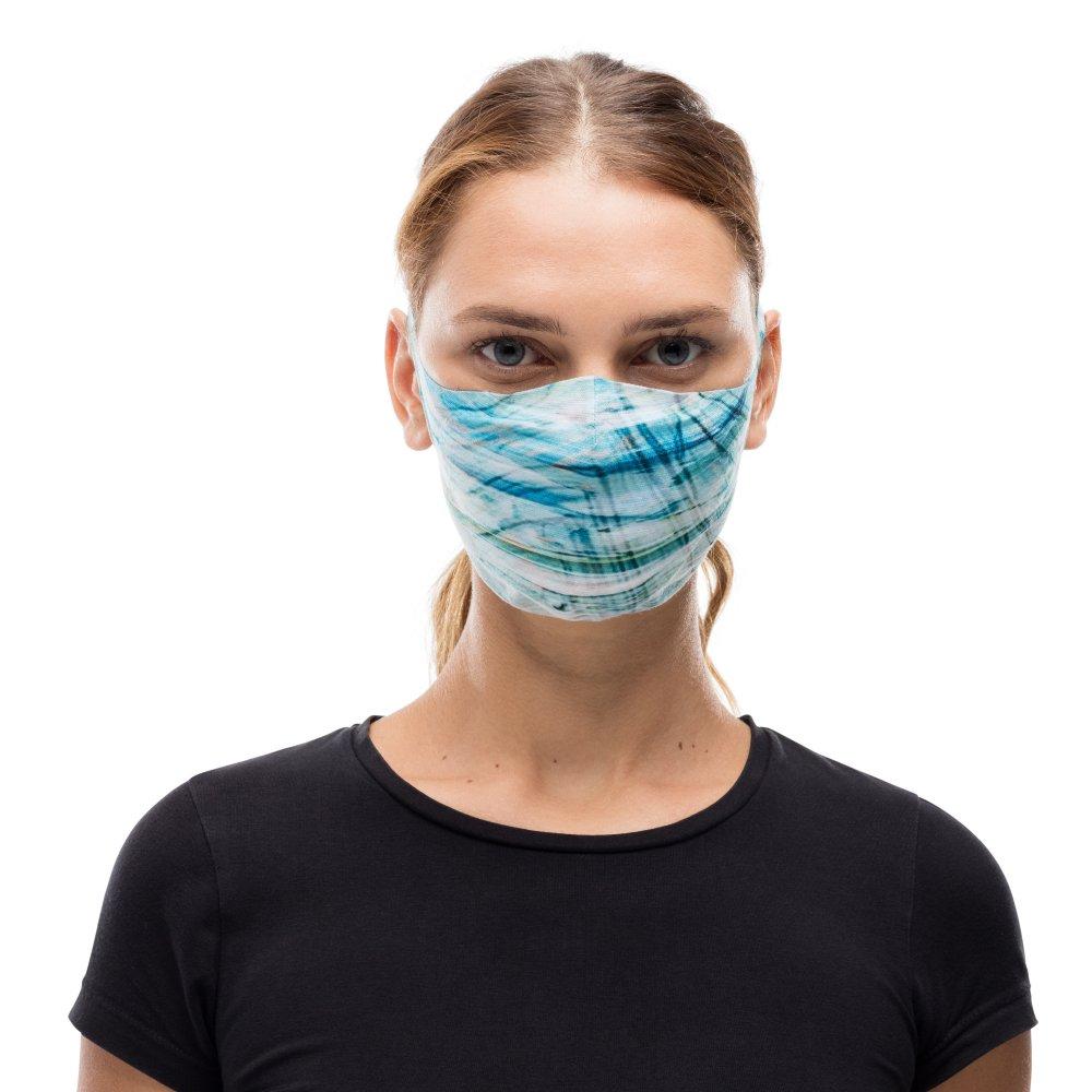 A woman wearing a Buff Filter Mask in Makrana Blue Sky