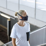 A woman wearing a Buff Filter Mask in Solid Black