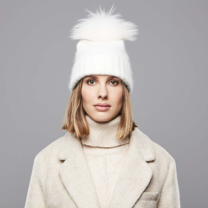 A woman wearing a Chaos Giana Beanie in Winter White